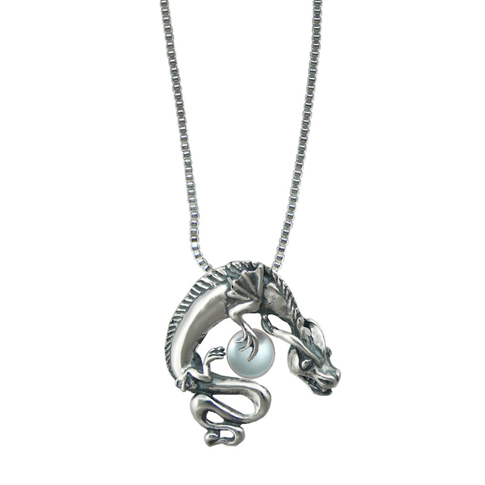 Sterling Silver Playful Dragon Pendant With Blue Topaz